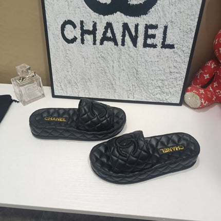 CHANEL 26S QUILTED SLIDE SANDALS IN BLACK CALFSKIN