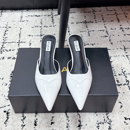 ALAIA 26S HEELED MULES 65 MM IN WHITE GLOSSY CALFSKIN