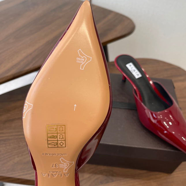 ALAIA 26S HEELED MULES 50 MM IN DARK RED GLOSSY CALFSKIN