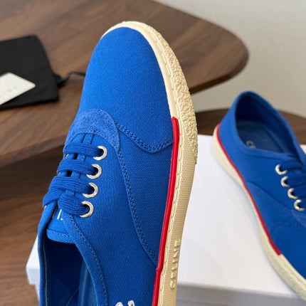 CELINE 26S TRIOMPHE LOW TOP SNEAKERS IN BLUE CANVAS RED TRIM