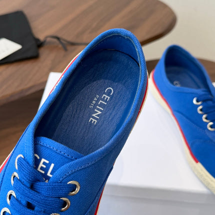 CELINE 26S TRIOMPHE LOW TOP SNEAKERS IN BLUE CANVAS RED TRIM