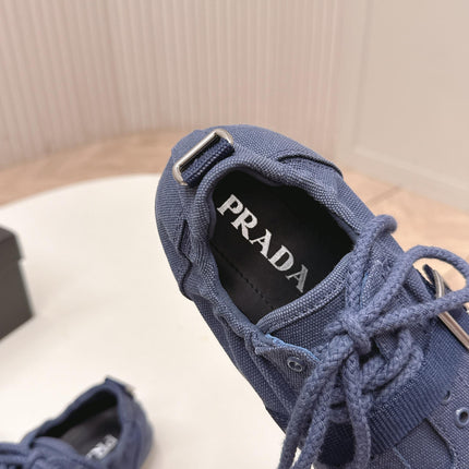 PRADA 26S LACE UP MINIMAL SNEAKERS IN NAVY BLUE CANVAS