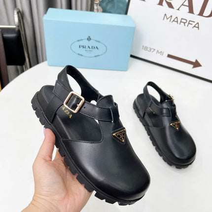 PRADA 26S RUBBER LOGO CHUNKY SOLE FISHERMAN SANDALS IN BLACK CALFSKIN