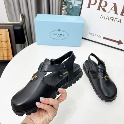 PRADA 26S RUBBER LOGO CHUNKY SOLE FISHERMAN SANDALS IN BLACK CALFSKIN