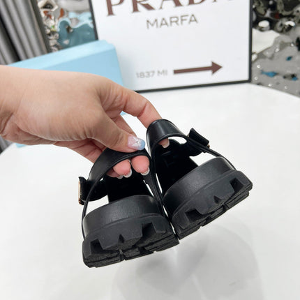 PRADA 26S RUBBER LOGO CHUNKY SOLE FISHERMAN SANDALS IN BLACK CALFSKIN