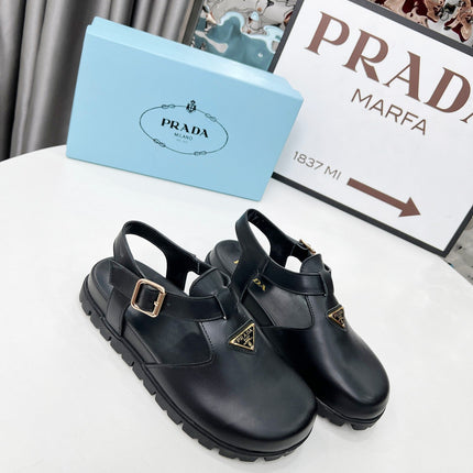 PRADA 26S RUBBER LOGO CHUNKY SOLE FISHERMAN SANDALS IN BLACK CALFSKIN