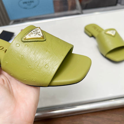 PRA SAFFIANO PATENT SLIDES OSTRICH MOTIF PEAR CALFSKIN