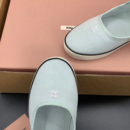 MIUMIU 26S MARY JANE FLATS IN PALE MINT CANVAS LOGO
