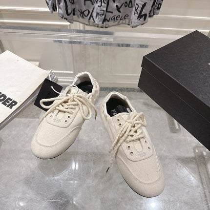 PRADA 26S COLLAPSE SNEAKERS IN WHITE CANVAS
