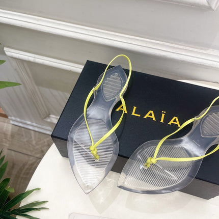 ALAIA 26S POINTED-TOE THONG SANDALS IN LIGHT YELLOW SATIN AND TRANSPARENT PVC