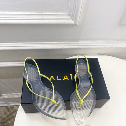ALAIA 26S POINTED-TOE THONG SANDALS IN LIGHT YELLOW SATIN AND TRANSPARENT PVC