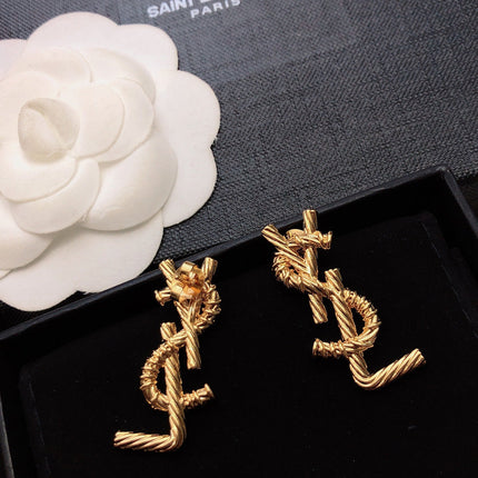 YSL 26S TWISTED ROPE LOGO STUD EARRINGS IN GOLD TONE METAL 629135